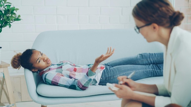 a-therapy-session-with-a-psychologist-and-a-patient-on-a-sofa-focusing-on-emotional-well-being.-36729383-2048x1152 Medium