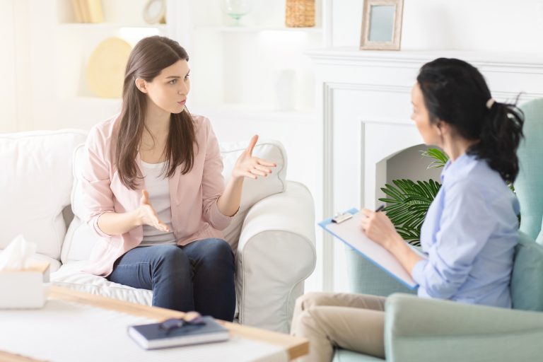 A patient speaks to a therapist